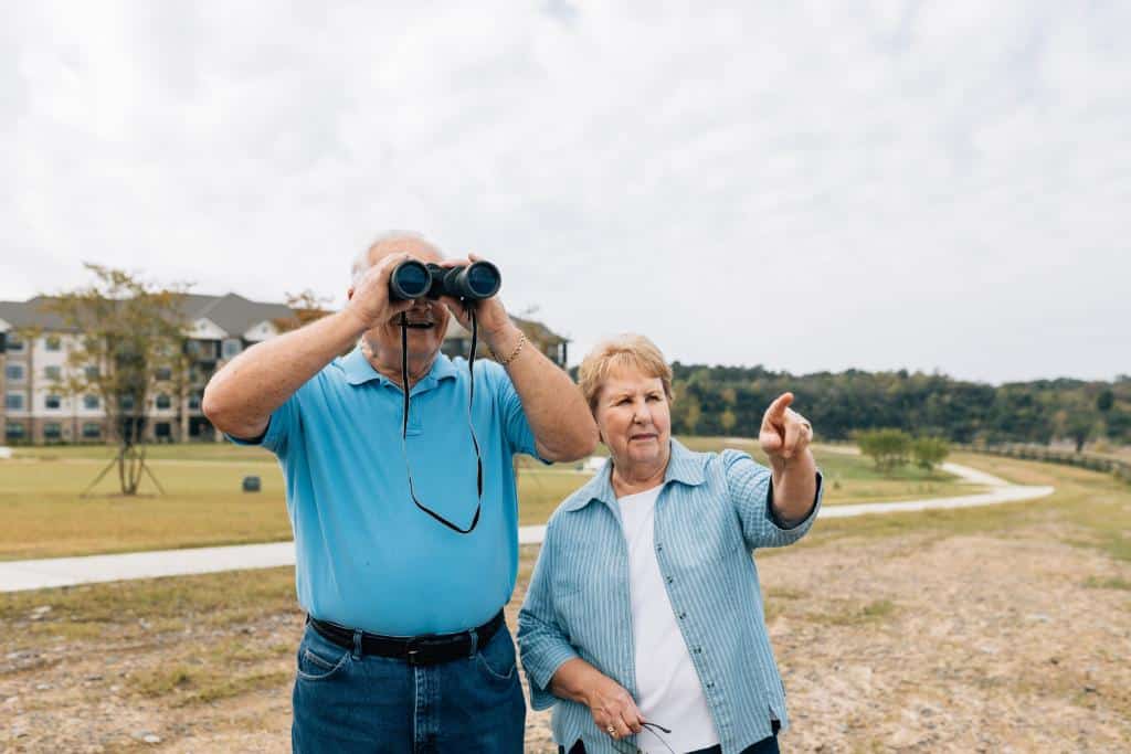senior couple birdwatching